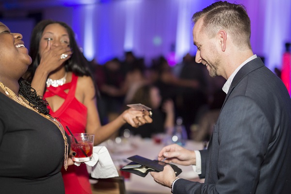 Brian Masters performing strolling magic 